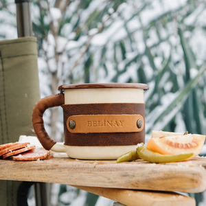 Adventure cup with handcrafted leather protection ideal for hiking and camping, outdoor front view