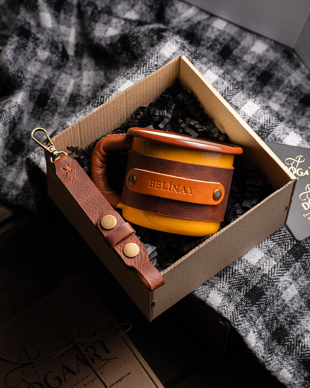 Dogaart yellow leather-wrapped enamel mug displayed inside premium gift box packaging with product details visible