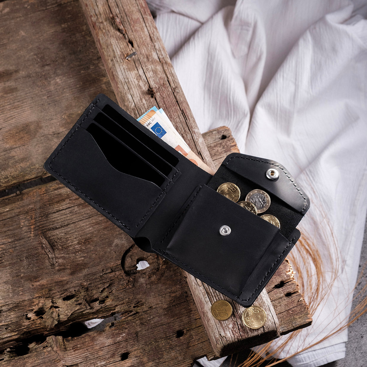 Dogaart Rio handcrafted black crazy leather wallet interior compartment view showing spacious design