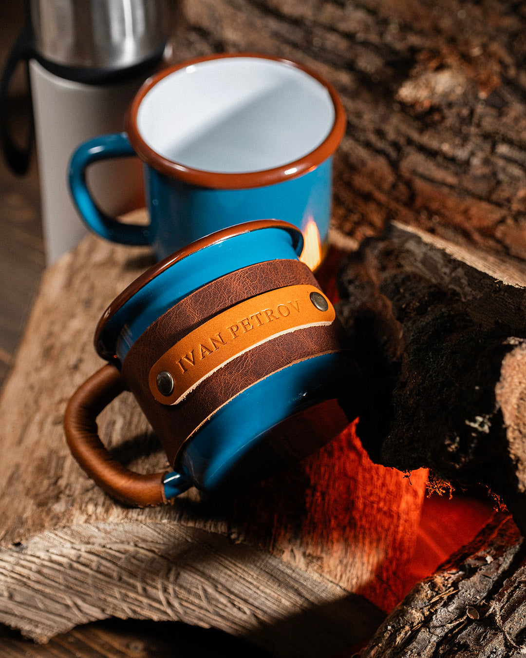Metal enamel mug 330ml with removable leather sleeve showing wrapped and unwrapped versions side by side